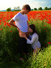 Romantic girl and her boyfriend fucking on the flower field
