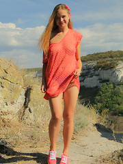 Gorgeous teen embraces the summer with stripping off her clothes in front of beautiful scenery where she can feel free.